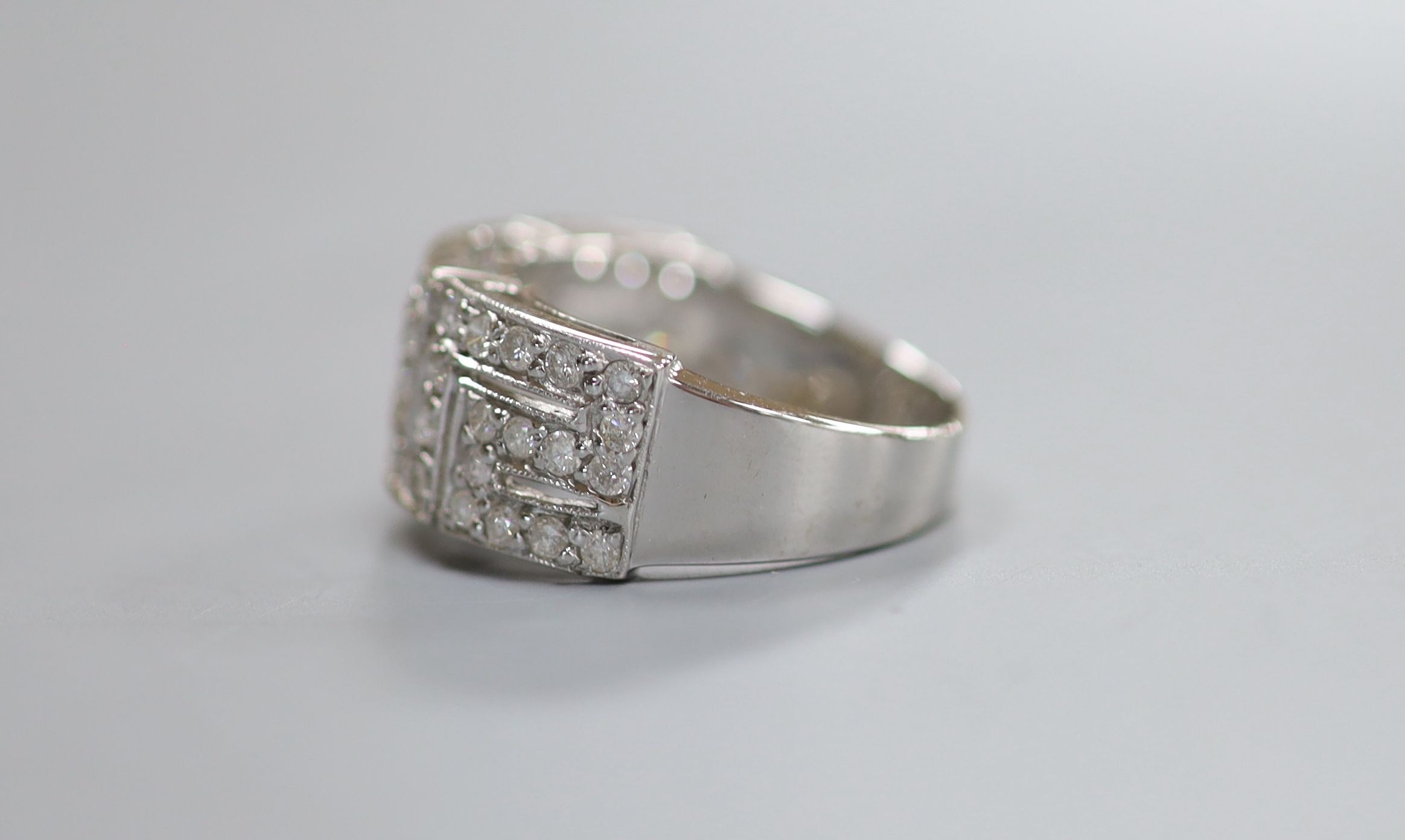 A modern 18ct white gold and diamond set 'Greek Key' dress ring, size P/Q, gross weight 5.4 grams.